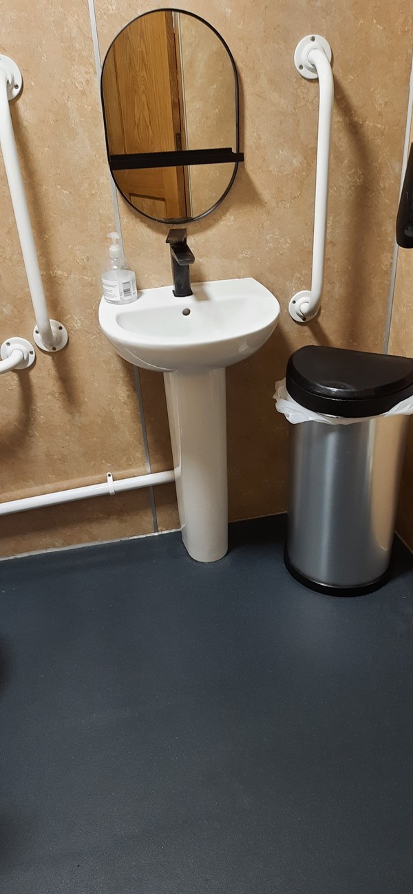 Picture of a sink with grabrails