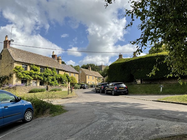 Image of a street and parked cars
