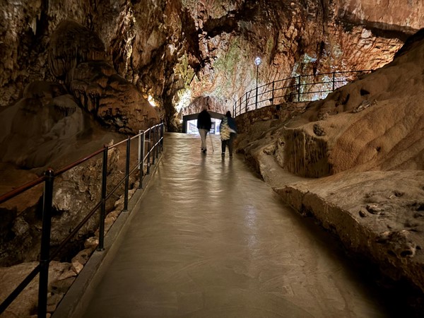 Image of a People walking in a cave