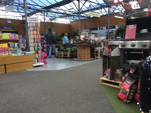 Image of the inside of a  garden centre with a variety of products