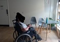 Wheelchair user by a table