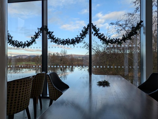 Image of pond through the windows of Annandale Water Services