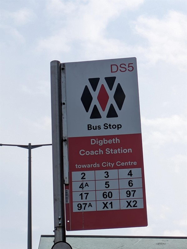 Image of signage at bus stop outside