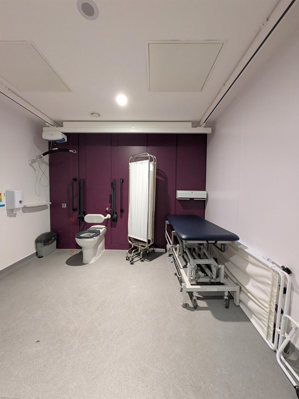 image of toilet and changing bench inside the Changing Places bathroom