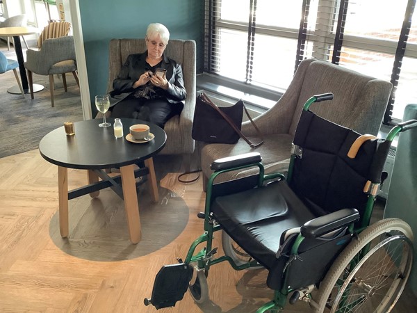 Picture of someone seated in a bar area