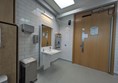 Image of sink and door to accessible toilet