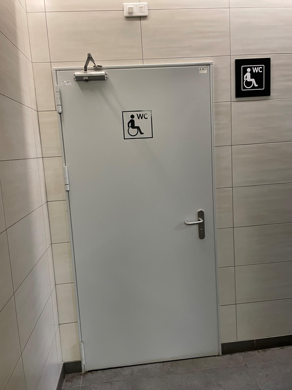 Image of an accessibe toilet door