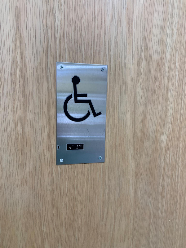 Loo sign with braille