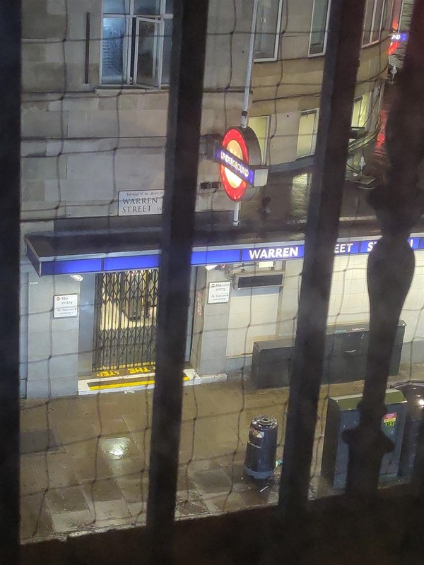 Window view to Warren Street tube station.