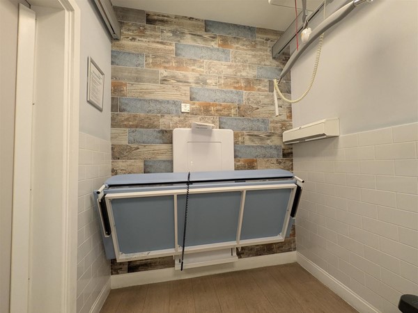 Image of Adjustable change bed in the Changing Places toilet