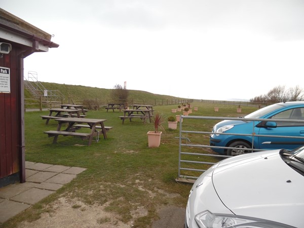 Picture of Winchelsea Beach Cafe - This is the extra outside seating area, also shows the car parking area too. this was our stop off for food after looking at the birds on the Pett Level ponds that can be viewed from the side of the road. A fantastic day of combined birding and a meal out, that caters for vegetarians and carnivores alike.