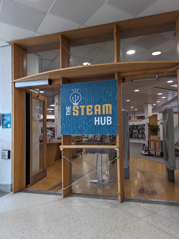 Image of a sign on the door of a building