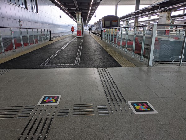 Image of platforms and tactile metal marking
