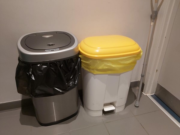 Bins right next to the entrance in accessible toilet 2