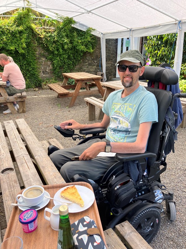 Powerchair user having lunch