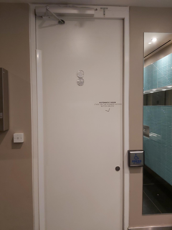 Push button door for accessible toilet