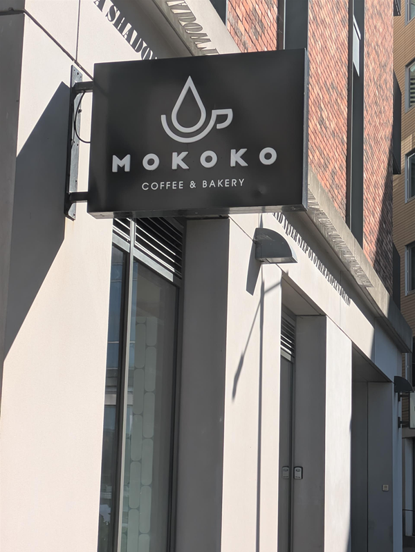 Image of signage for Mokoko from outside