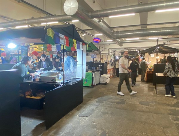 Image of people and stalls