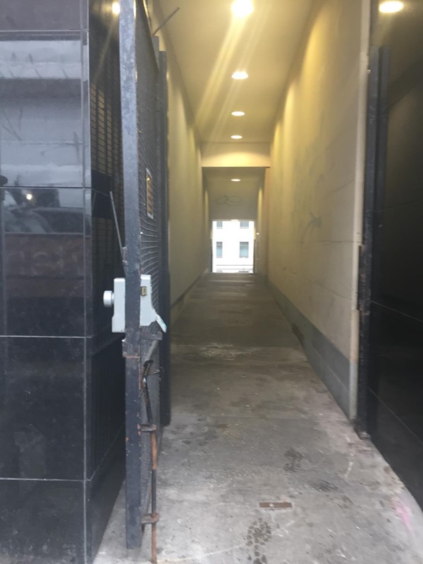 Side entrance to the right of the main entrance used to access the platform lift to enter the main foyer. There is another door down this corridor on the left that leads to the platform lift.