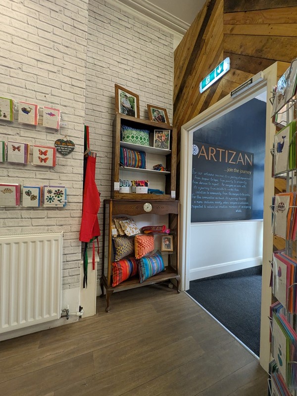 Image of entrance from the inside, a wide white door frame