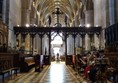 Tewkesbury Abbey looking back along nave from altar. Ramp access from side.