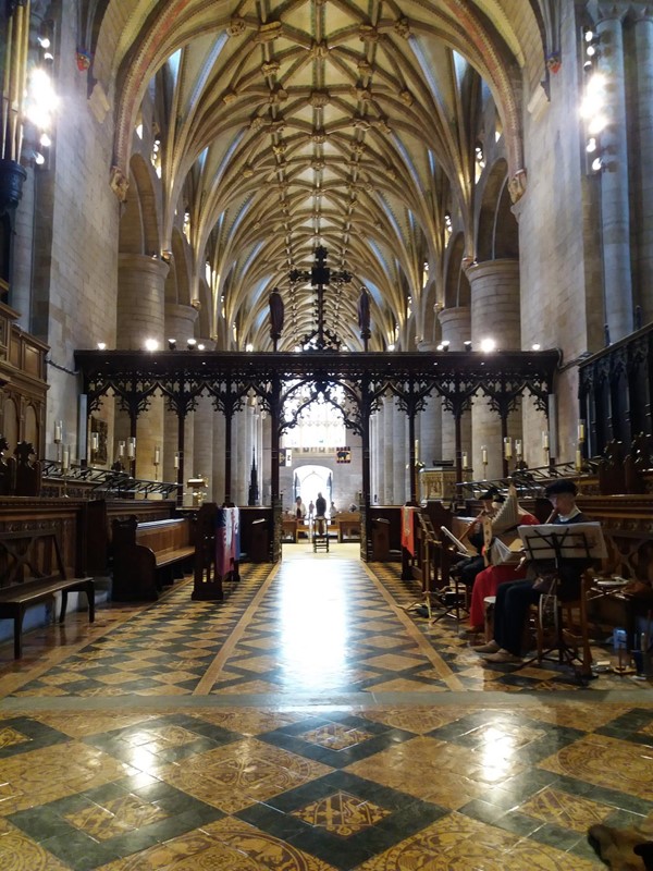 Tewkesbury Abbey looking back along nave from altar. Ramp access from side.