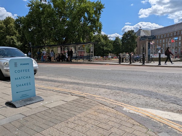 Image of signage outside the café