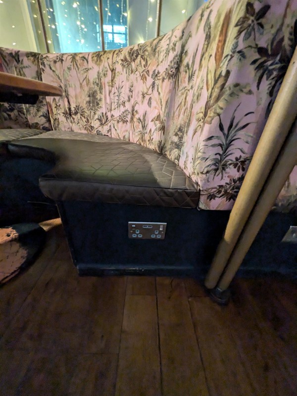 Image of seating booth with power socket