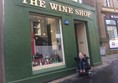 Image showing the outside of The Wine Shop with Claire outside.