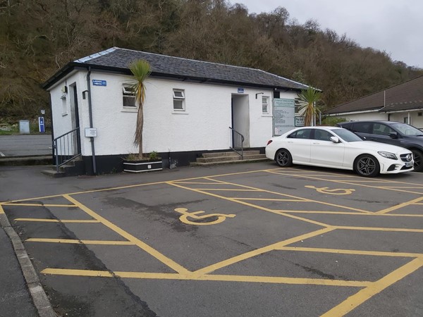 Image of the parking spaces beside the accessible toilet building.
