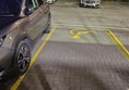 Image of a bollard and disabled parking space