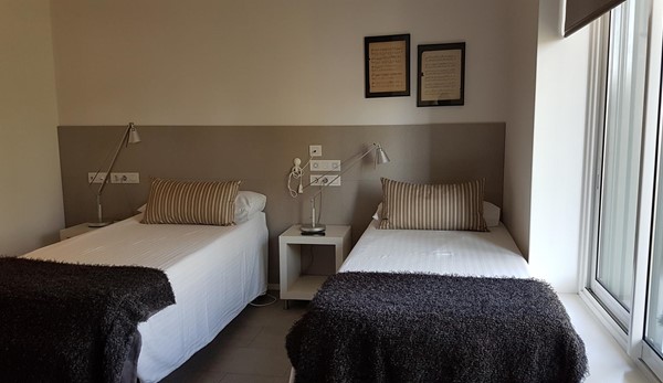 Accessible bedroom with adjustable beds.