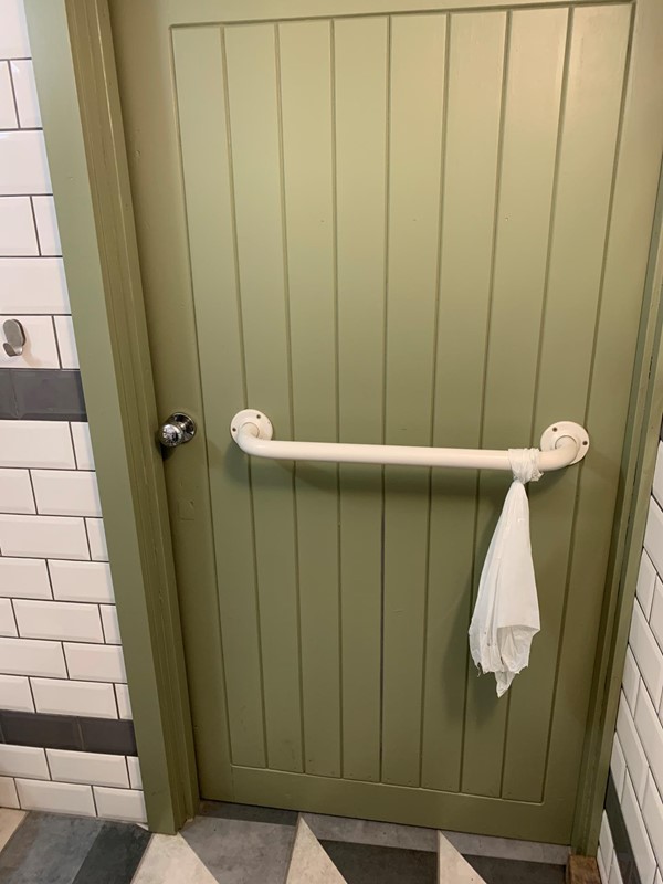No lock, so no way to ensure your privacy. And someone outside with the ability to lock you in.