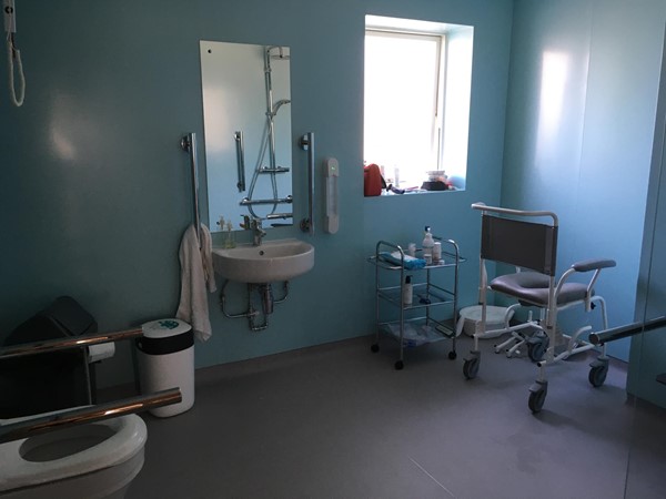 Accessible wet room with Clos o mat toilet and handy wee trolley.
