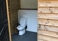 Level access toilet