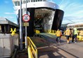 The vehicle loading area on the ferry, with a sturdy metal ramp which is fairly level.