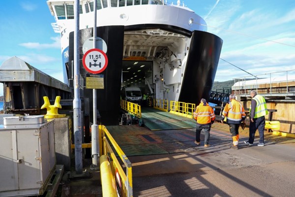 The vehicle loading area on the ferry, with a sturdy metal ramp which is fairly level.