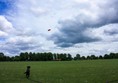 Large field with trees behind.