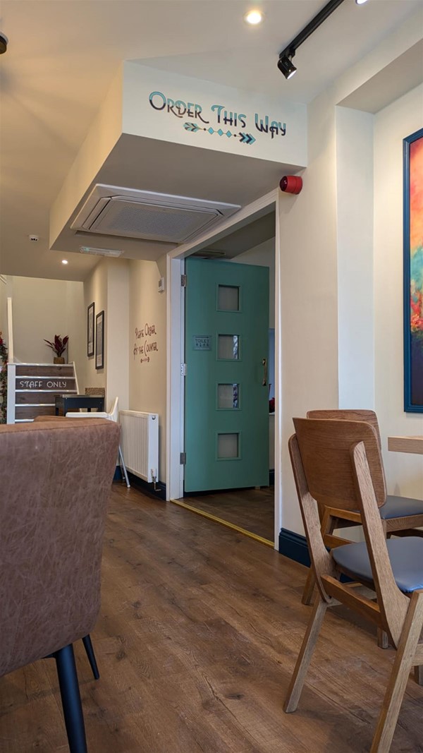 Cafe area leading to the shop.