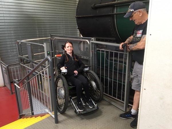 Picture of a wheelchair user using a chairlift