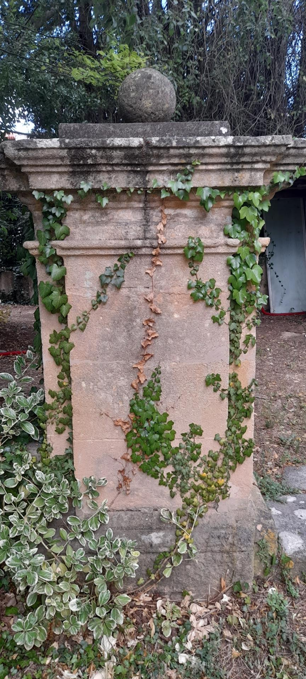 Image of a stone pillar with a sphere on the top