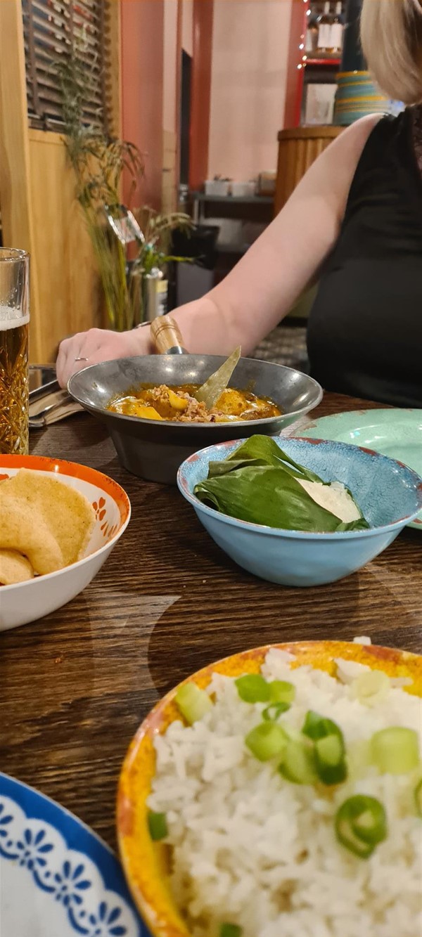My friends chicken katsu curry and sticky rice in vine leaf