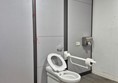 Image of a toilet and grab rail
