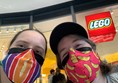Picture of people in masks outside the Lego store
