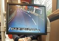 Display screens with subtitled commentary located at the wheelchair spaces.