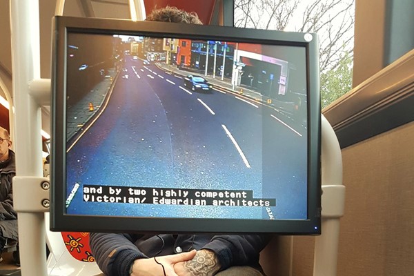 Display screens with subtitled commentary located at the wheelchair spaces.