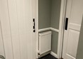 Image of a white door with accessible baby changing