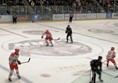 Image of a hockey game with people watching