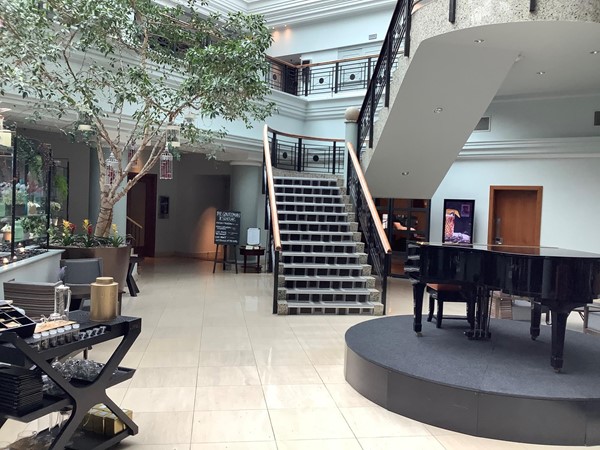 Piano on a raised dais with some stairs in the background