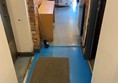 Picture of a doormat in a corridor